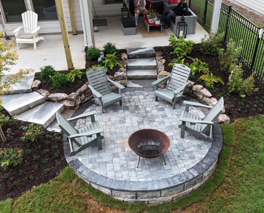 patio with patio, retaining, wall, and fire pit
