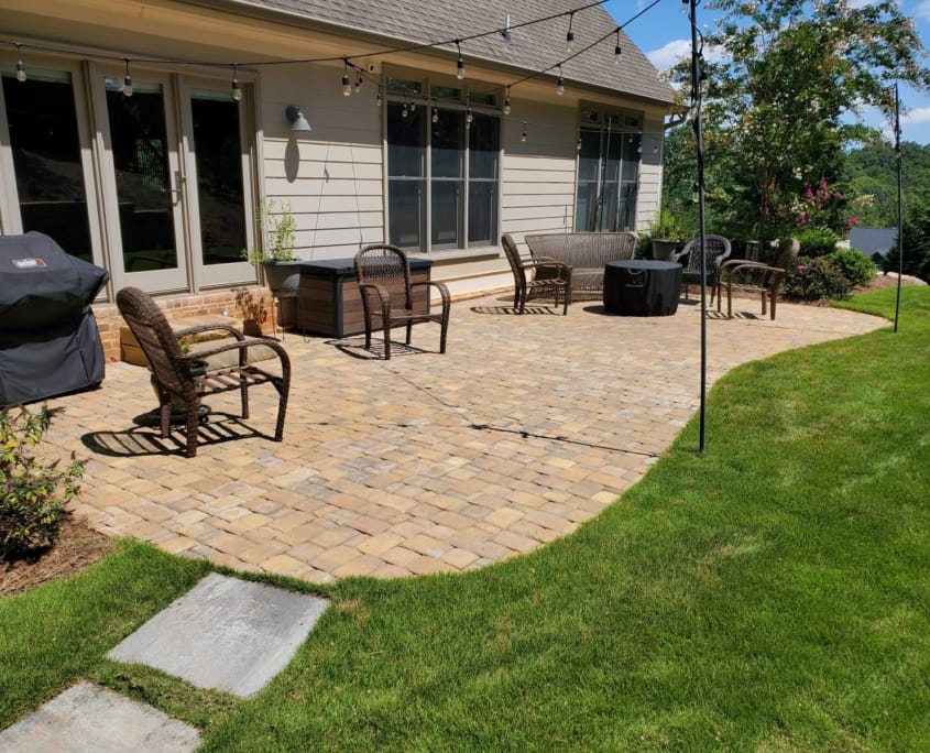 backyard patio with string lights and seating